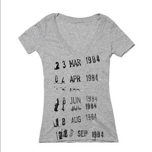 Out of Print Library Book Tee